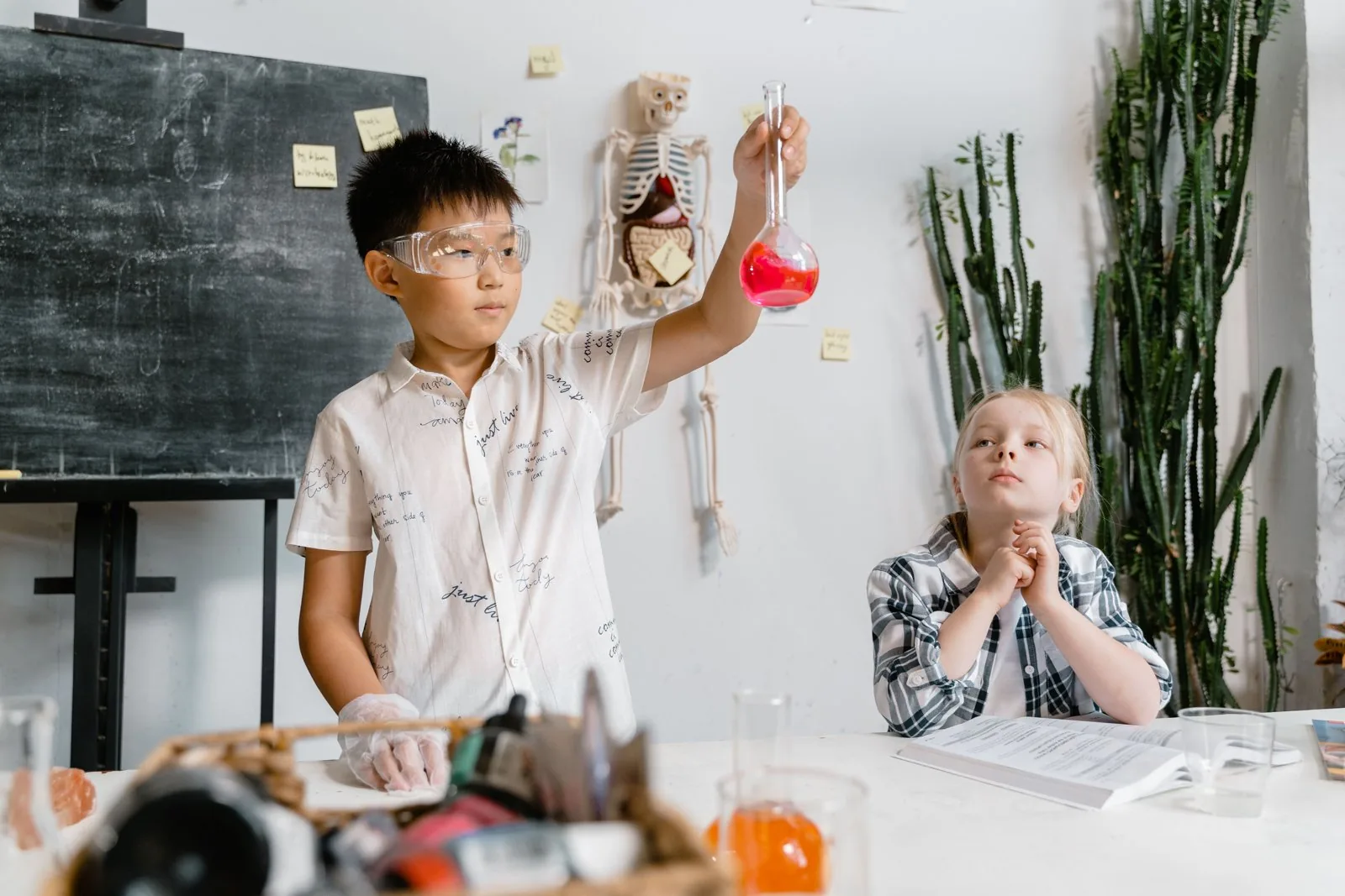 Children conducting a supervised experiment